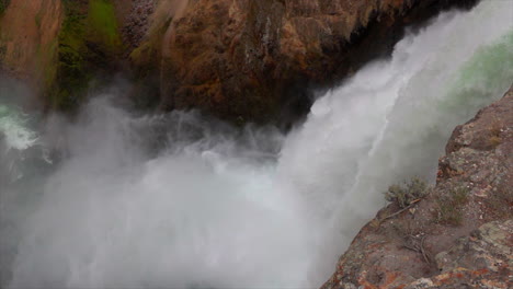 Ultra-slow-motion-shot-of-Upper-Falls-of-the-Yellowstone-River-with-mist-blowing-out-from-the-base-of-the-falls
