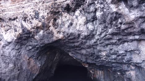 A-shot-sailing-towards--a-cave-entrance