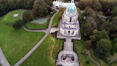 Historic-Ashton-memorial-English-domed-folly-landmark-Lancashire-countryside-sunrise-Aerial-rising-pull-back-view