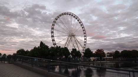 La-Grande-Roue-de-Montreal-At-Sunset---Ferris-Wheel-At-The-Old-Port-Of-Montreal-Empty-During-The-Pandemic-Coronavirus-In-Quebec,-Canada