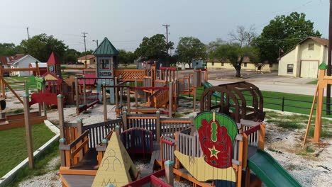 Aerial-view-truck-right-to-left-of-a-playground-in-Ponder-Texas