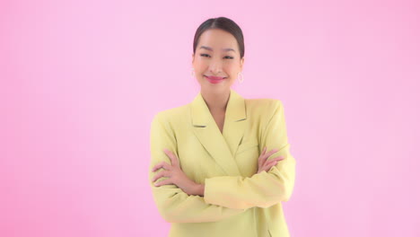 A-young-businesswoman-in-a-pastel-yellow-suit-has-a-positive,-confident,-attitude