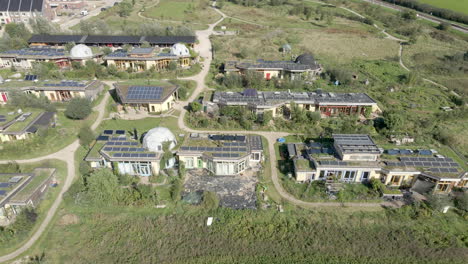 Wide-Aerial-dolly-of-beautiful-earthship-district-in-Olst,-the-Netherlands