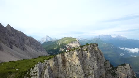 aerial-of-Massive-mountain-ridges-in-the-Italian-Alps,-Refugio-Tissi,-Alleghe