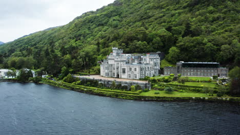 Dolly-out-aerial-shot-of-the-beautiful-Benedictine-castle-called-Kylemore-Abbey
