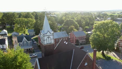 Beautiful-establishing-shot,-aerial-of-church-in-small-town-America