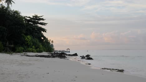 Slow-motion-shot-of-beautiful-empty-tropical-beach-in-the-evening-at-Asu-Island,-North-Sumatra,-Indonesia