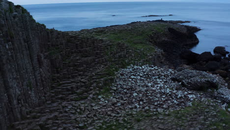 Ireland-Landscape---basalt-column-rocks-on-Northern-Coastline,-Aerial-establishing-view