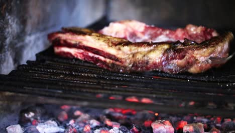 Close-up-of-meat-on-a-Grill-with-fire