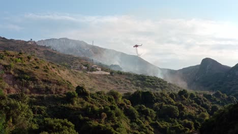 Firefighting-Helicopter-Drops-Water-on-Burning-Forest