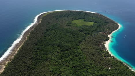 Aerial-view-of-jungle-and-palm-tree-covered-island-with-beautiful-beach-in-North-Sumatra,-Indonesia