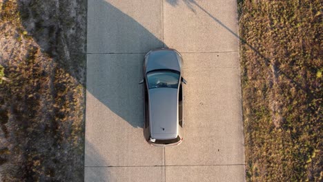 Drone-shot-of-a-car-on-the-street