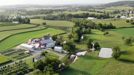 Lancaster-County-Pennsylvania,-rolling-hills,-contour-farming,-farmland-during-summer,-high-aerial-shot