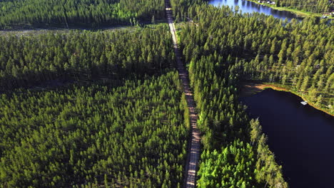 Road-through-the-green-Vansbro-municipality,-Dalarna-county-in-Sweden---Aerial