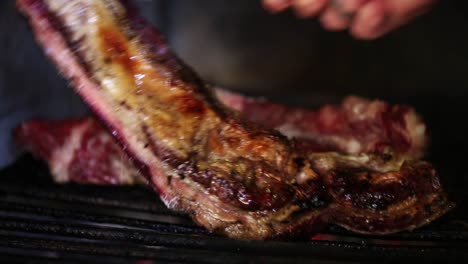 Close-up-of-a-man-Cooking-an-Argentinian-asado-on-a-Grill