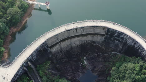 Aerial-view-of-a-water-dam-on-a-small-mountain-river