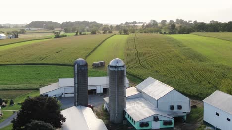 Rural-America,-aerial-of-farm-buildings-and-harvest-season