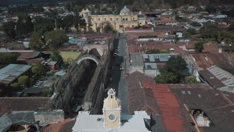 Drone-aerial-flyover-Santa-Catalina-arch-and-La-Merced-church-in-colonial-city-Antigua-Guatemala