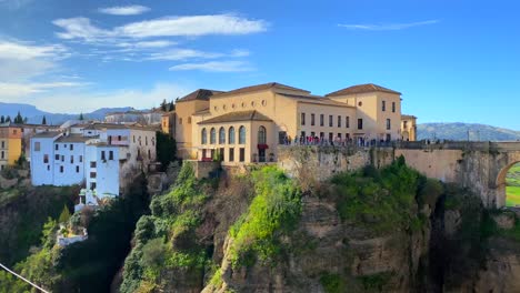Beautiful-blue-sky-and-city-view-on-historical-Puente-Nuevo-bridge-in-Ronda-Spain,-4K-panning-right