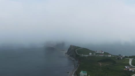 Perce-Rock-At-The-Gulf-Of-Saint-Lawrence-Near-The-Perce-City---Gaspe-Peninsula-On-A-Foggy-Morning-In-Quebec,-Canada