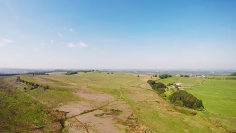 Panoramic-aerial-shot-of-the-expansive-farmlands-of-Yorkshire-in-summer