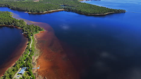 Beautiful-blue-waters-and-forest-landscape-of-Busjön,-Vansbro,-Sweden