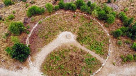 Top-View-Of-Stone-Circle-In-An-Archaeological-Site-Near-Lake-Lesno-Dolne-In-Pomeranian-Voivodeship,-Chojnice-County,-Poland---orbiting-drone-shot
