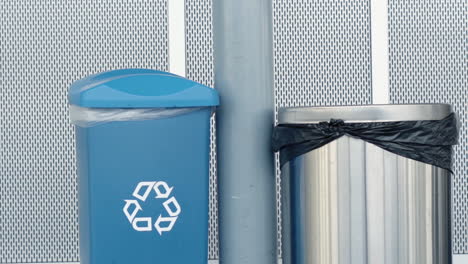 Garbage-can-and-recycling-bin-side-by-side-in-building-hallway