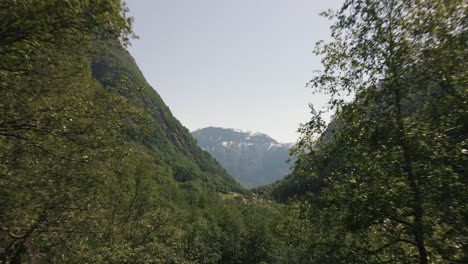 Drone-video-of-a-green-valley-located-in-the-region-of-Hardanger,-Norway