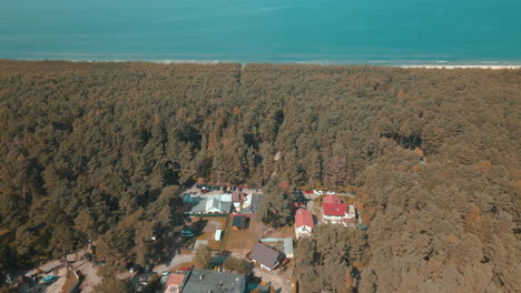 Aerial-tilt-up-view-of-the-small-town-of-Debki-in-the-north-of-Poland-by-the-sea