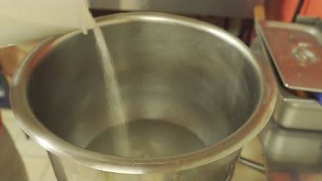 Sugar-Being-Poured-into-Large-Mixing-Bowl