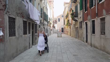 Mother-with-stroller-at-empty-streets-in-Venice