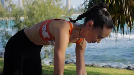 Sporty-Woman-Practicing-Yoga-Doing-Cat-Pose-At-Burleigh-Hill---Burleigh-Heads-Beach---Gold-Coast,-QLD,-Australia