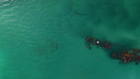 Aerial:-top-down-view-of-shipwreck-oil-spill-in-ocean