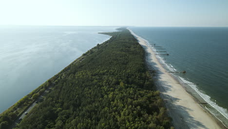 Slow-aerial-pull-back-movement-over-Kuznica-tourist-spot-in-Hel-Peninsula,-Poland,-baltic-sea