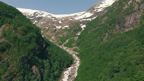 Drone-video-of-a-green-valley-located-in-the-region-of-Hardanger,-Norway