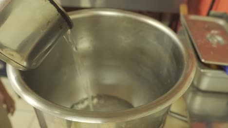 Water-Being-Poured-into-Large-Mixing-Bowl