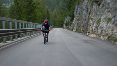 Stabilized-action-shot-of-a-Cyclist-in-high-speed-through-the-mountains