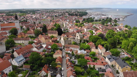 Aerial-view-of-town-of-Visby-with-many-houses-on-coast-of-Gotland-island