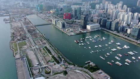 Hong-Kong-Kowloon-Bay-Area-Mit-Stadtwolkenkratzern-Und-Neuem-Kinderkrankenhausgebäude-Während-Des-Baus,-Luftbild