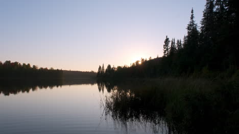 Slow-Tilt-Up-Peaceful-Calm-Lake-At-Dusk