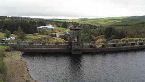 Alwen-reservoir-industrial-hydroelectric-landmark-historical-rural-lake-dam-building-aerial-rising-view-above-countryside