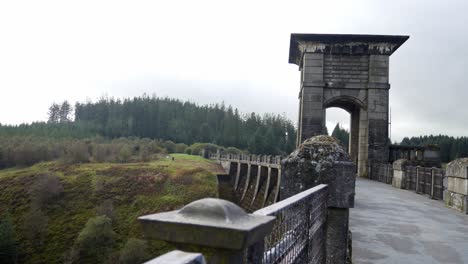 Historical-North-Wales-Alwen-dam-reservoir-landmark-building-close-left-dolly