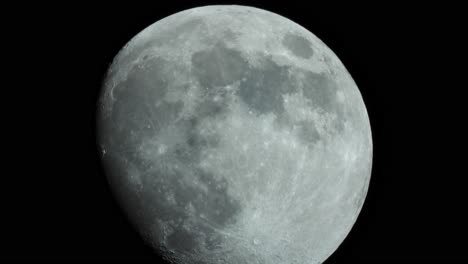 a-close-up-of-the-moon-with-its-craters,-moving-in-real-time