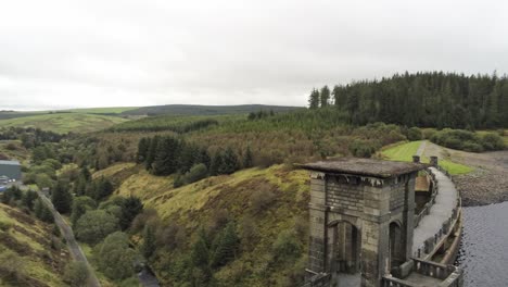Alwen-reservoir-countryside-hydroelectric-landmark-historical-aerial-dolly-right-passing-tower