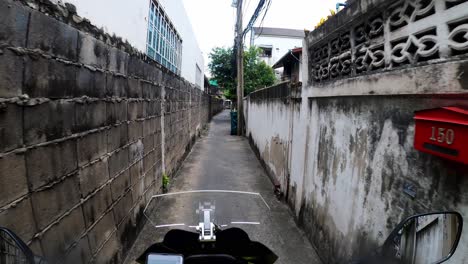 Traveling-along-a-narrow-road-of-the-streets-in-the-city-of-Bangkok