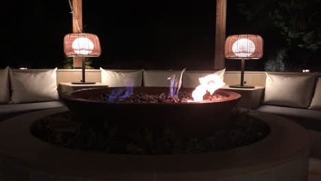 Close-up-view-of-a-fire-pit-in-front-of-a-sofa