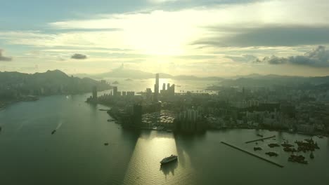 Hong-Kong-skyline-at-Sunrise,-High-altitude-wide-aerial-shot
