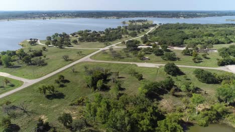 Aerial-flight-over-camping-spots-and-Promontory-Park-on-Lake-Proctor-in-Comanche-County-in-Texas
