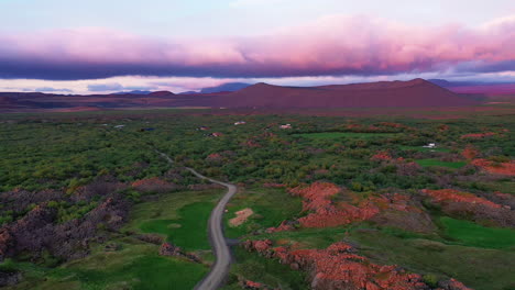 Bright-pink-sunset-over-Hverfjall-Crater---Myvatn-Area,-North-Iceland---aerial
